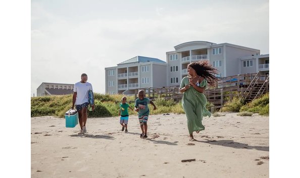 Big image galveston seaside resort family walking to the beach 1440x1080