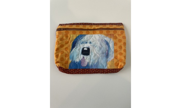 Big image big fluffy dog on orange background pouch   annual auction