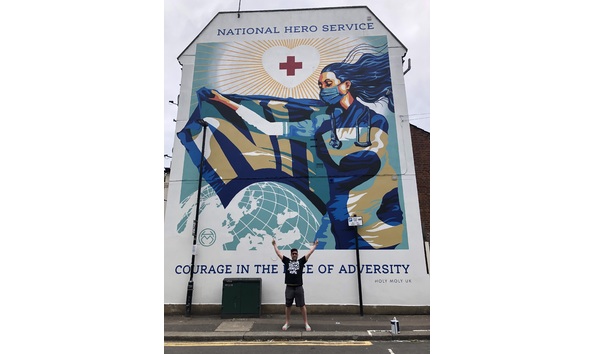 Big image holy moly in front of nhs mural
