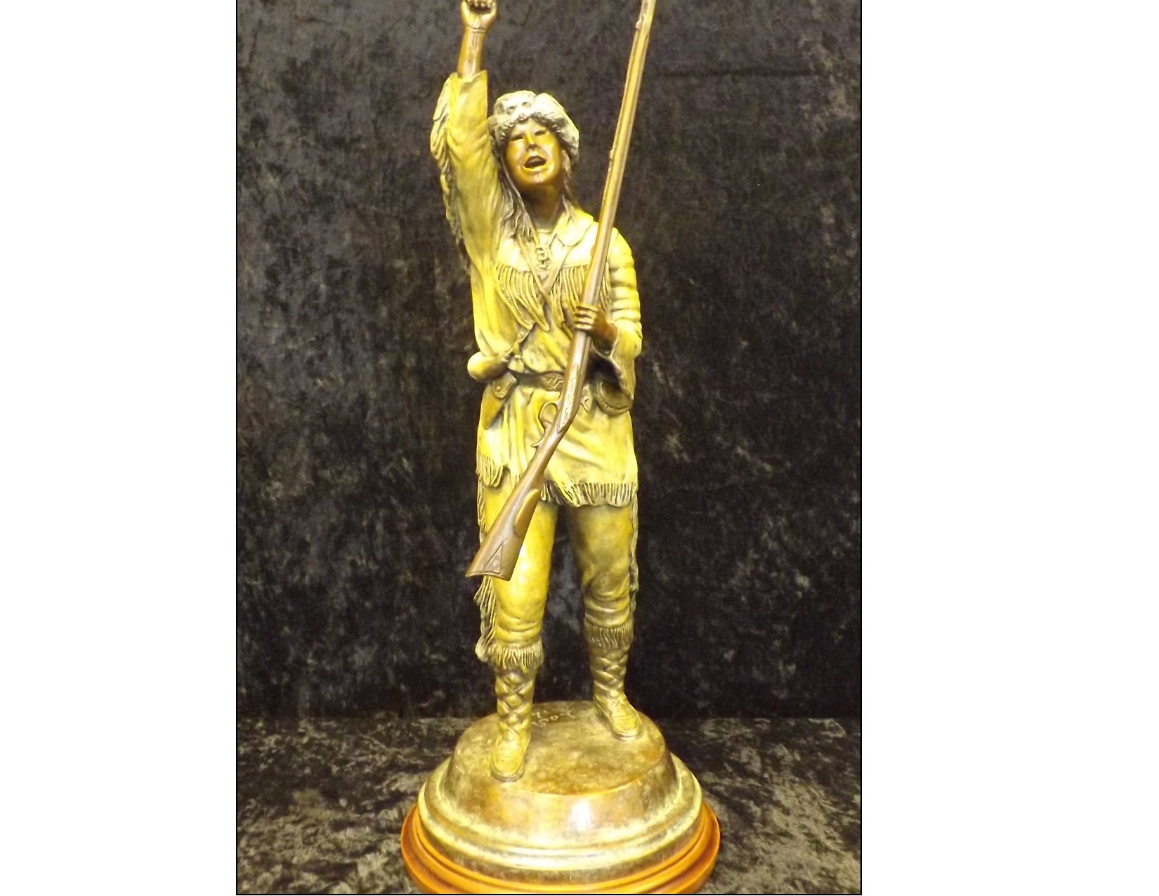 “Mountaineer” bronze sculpture by Burl Jones