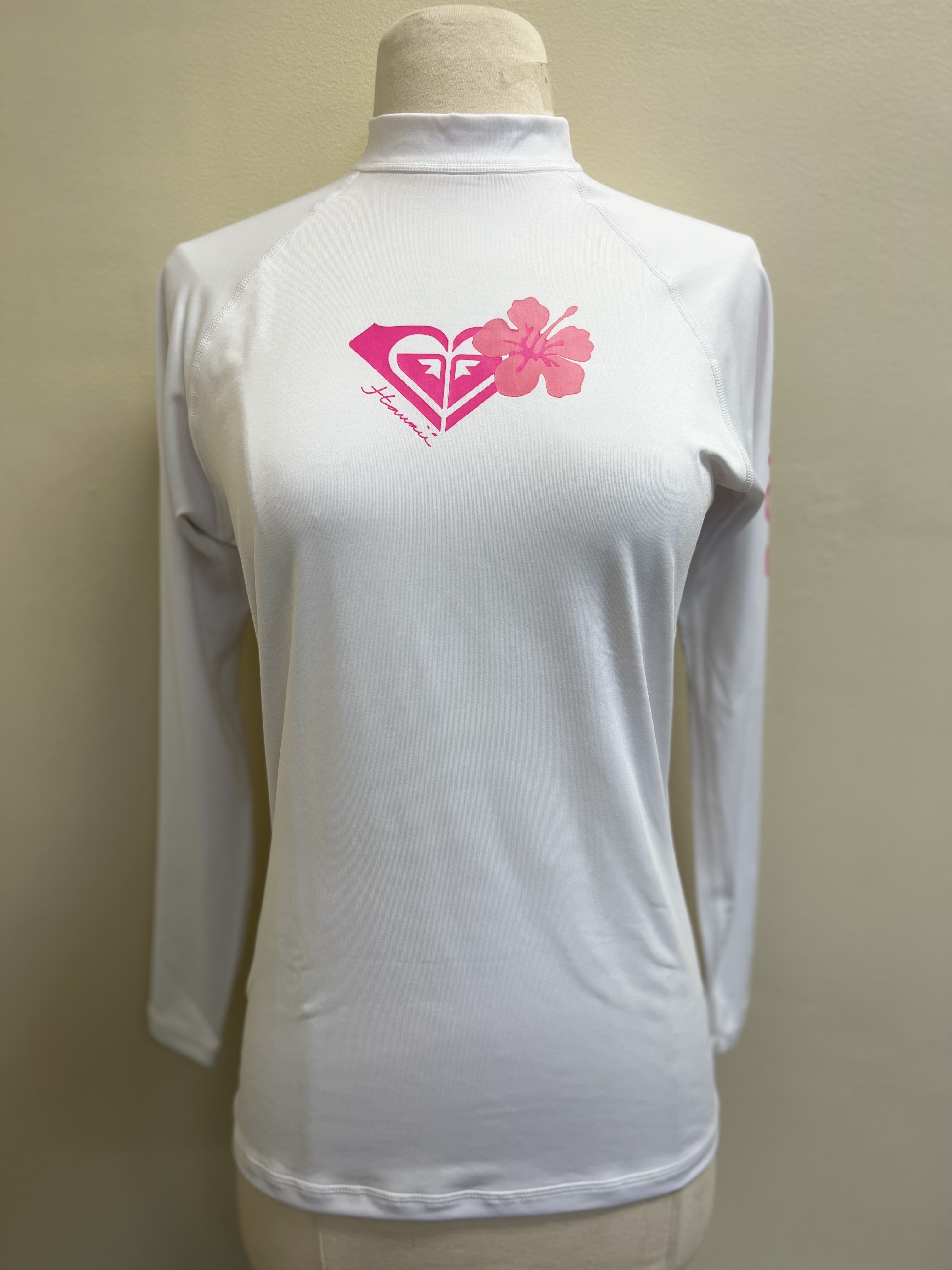White swim shirt with pink Roxy logo